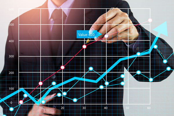 Business man tracking values on a chart