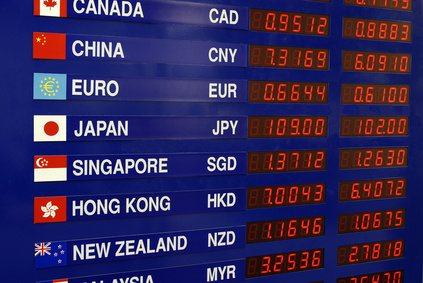 Board showing a list of currency exchange rates.
