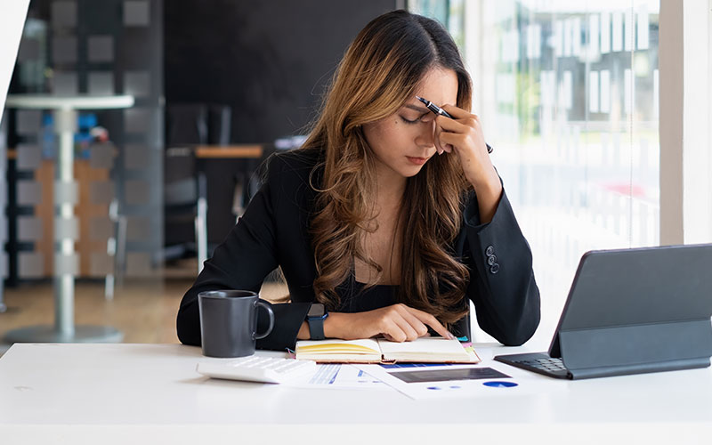 Image of a fustrated merchant dealing with a chargeback.