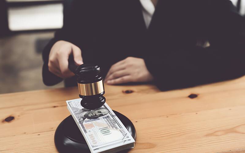 Judge with gavel in hand representing arbitration.