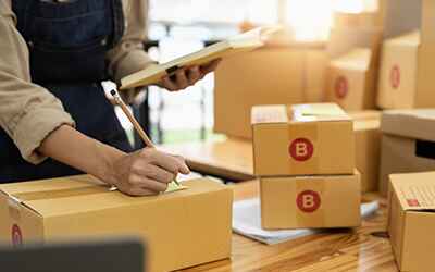 Merchant handling packages.