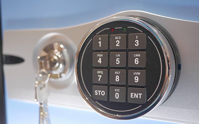 A lock with key and a keypad lock representing two-factor authentication.